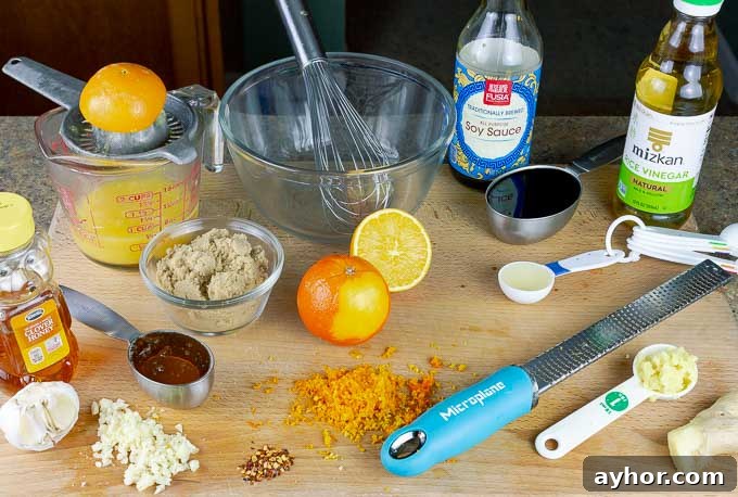 ingredients for Sticky Orange Chicken Recipe on a cutting board