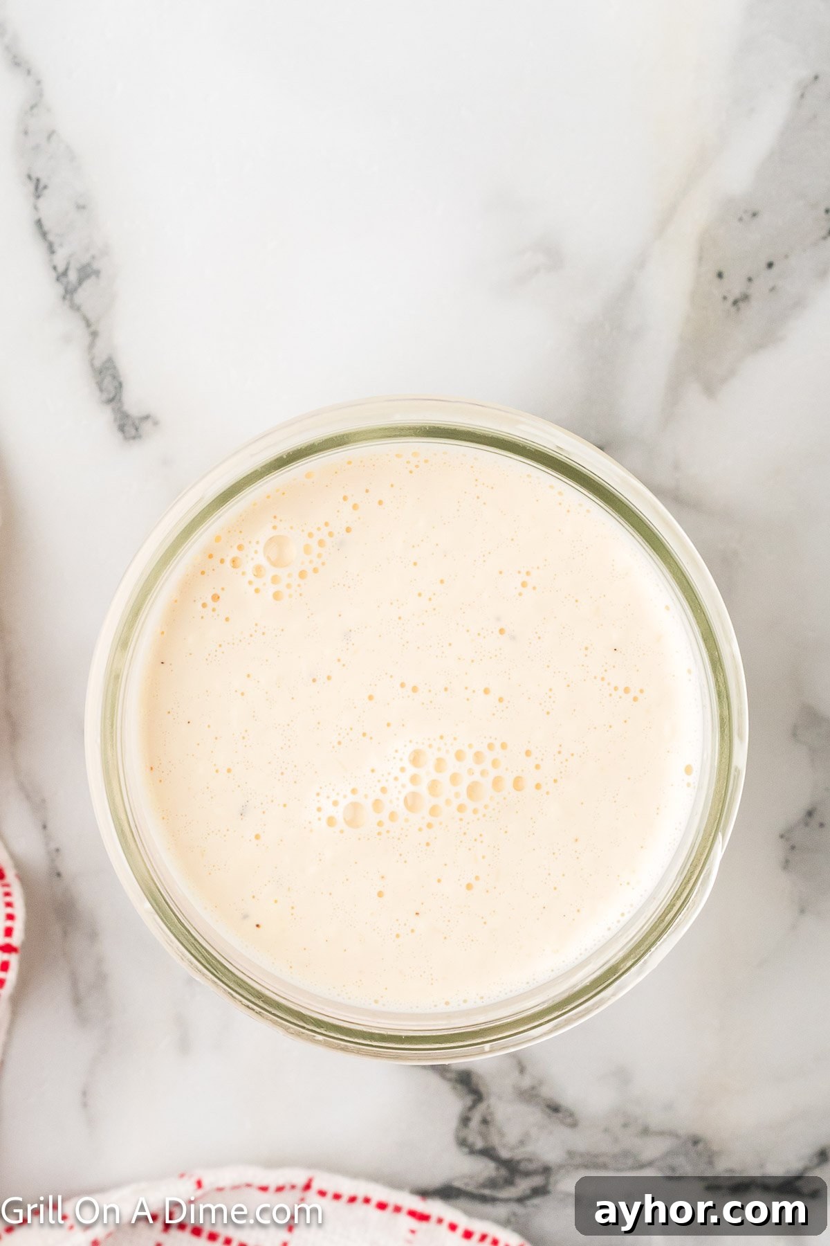 Alabama White BBQ Sauce Recipe: Tangy Homemade Chicken & Pork Glaze 5 Creamy white sauce in a jar