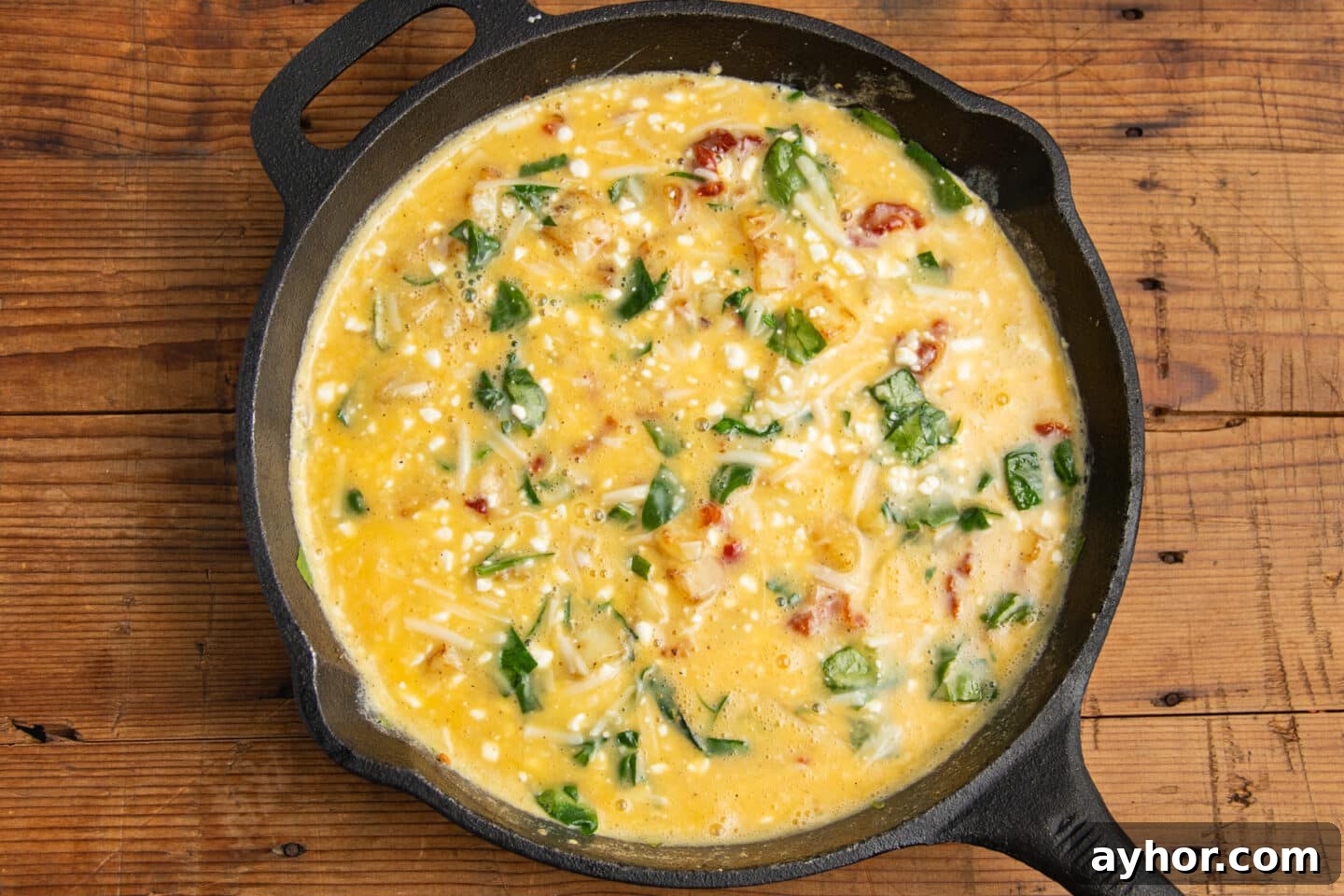 Sun-Dried Tomato and Cottage Cheese Frittata Recipe 11 This is a picture of the skillet with added egg mixture.