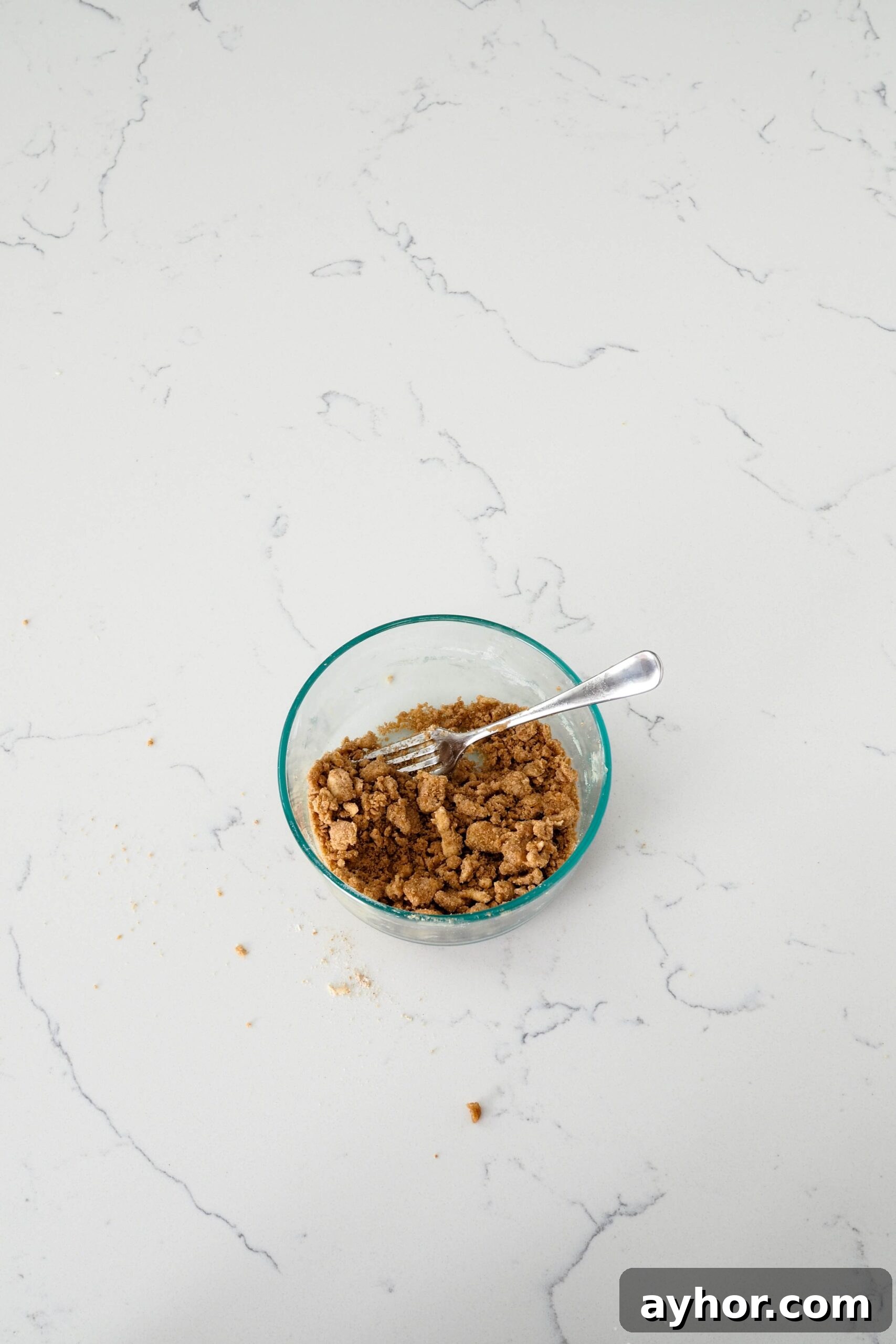 Caramel Chai Muffins Recipe — Warm Spiced Muffins with Caramel 6 Unbaked streusel topping, with a wide variety of clump sizes.