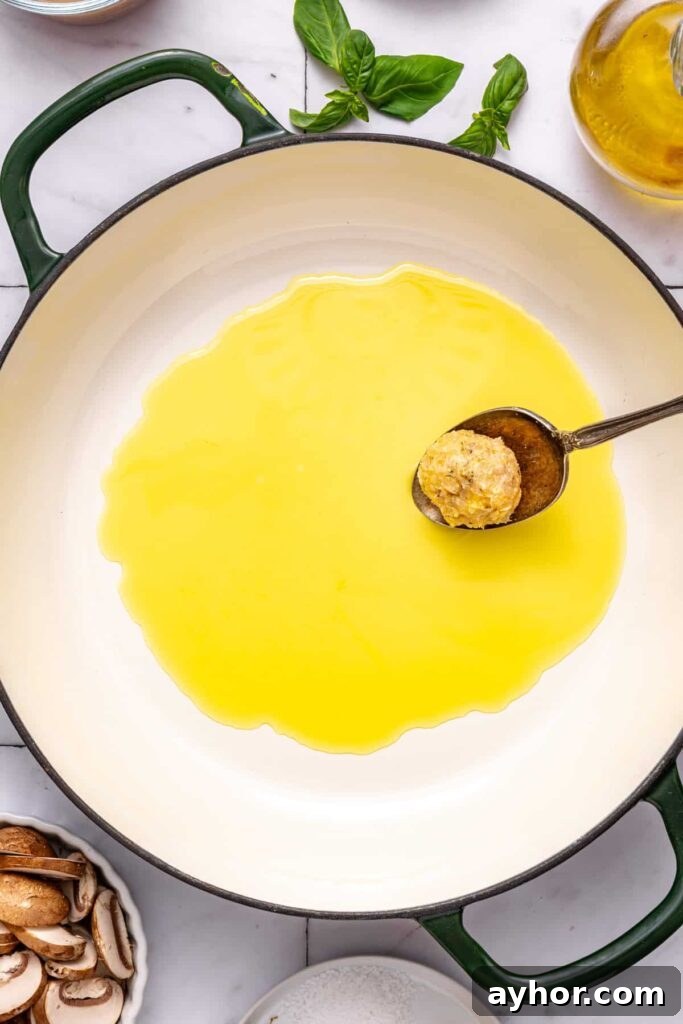 Cooking chicken meatballs in one pan until golden brown