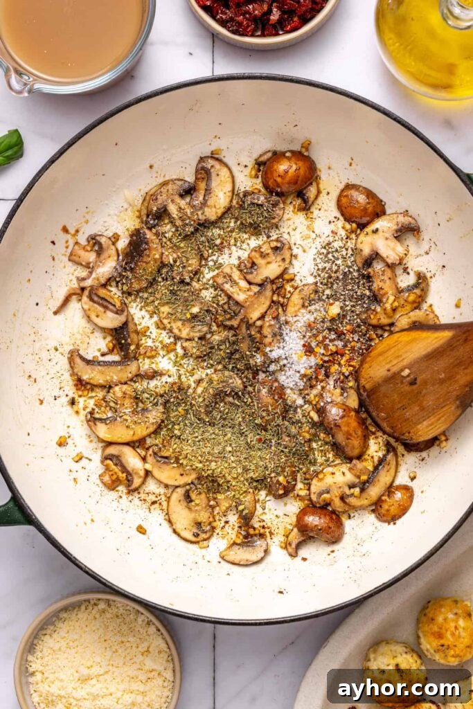 Adding dried herbs and spices to skillet for marry me chicken meatballs