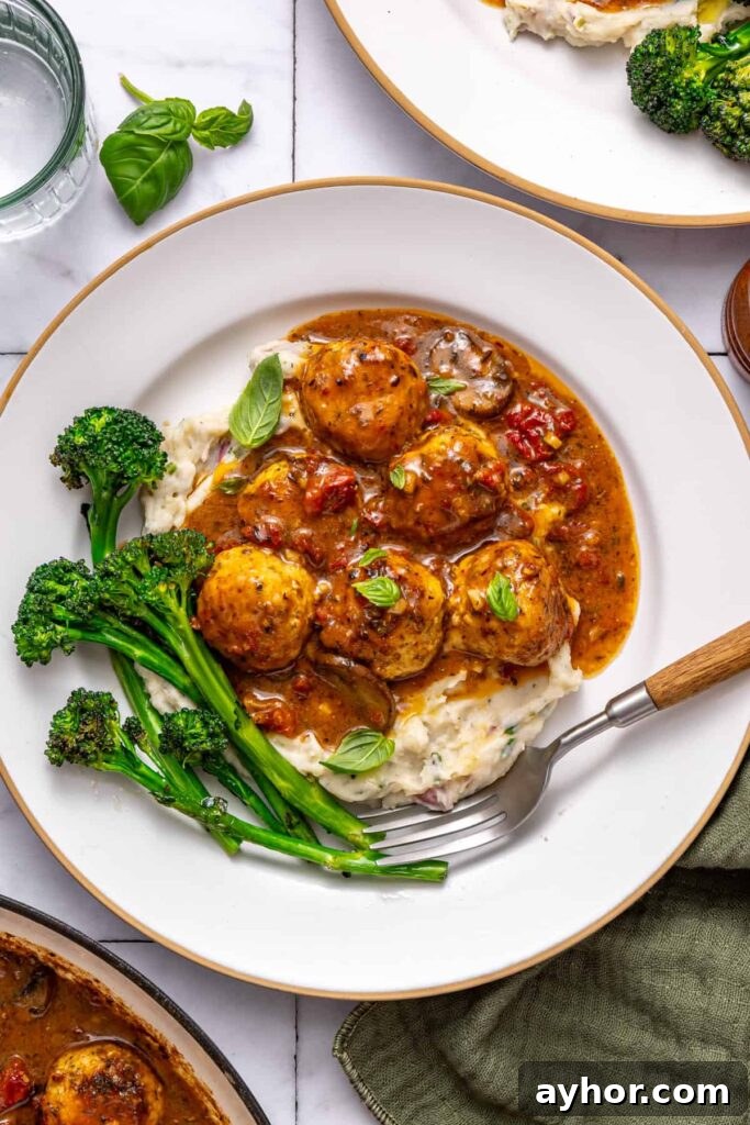 Cozy dinner table with creamy chicken meatballs meal