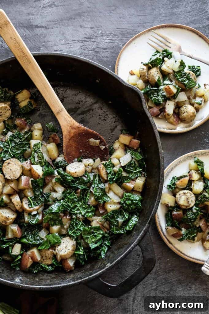 Gluten-Free Sausage, Kale & Potato Skillet Recipe 2 a cast iron skillet and two plates of gluten free sausage, kale and potato skillet