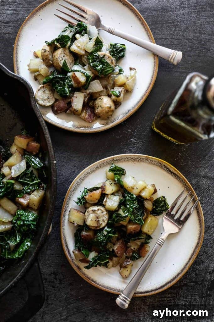 Gluten-Free Sausage, Kale & Potato Skillet Recipe 3 two plates of gluten free sausage, kale and potato skillet with a small bottle of olive oil