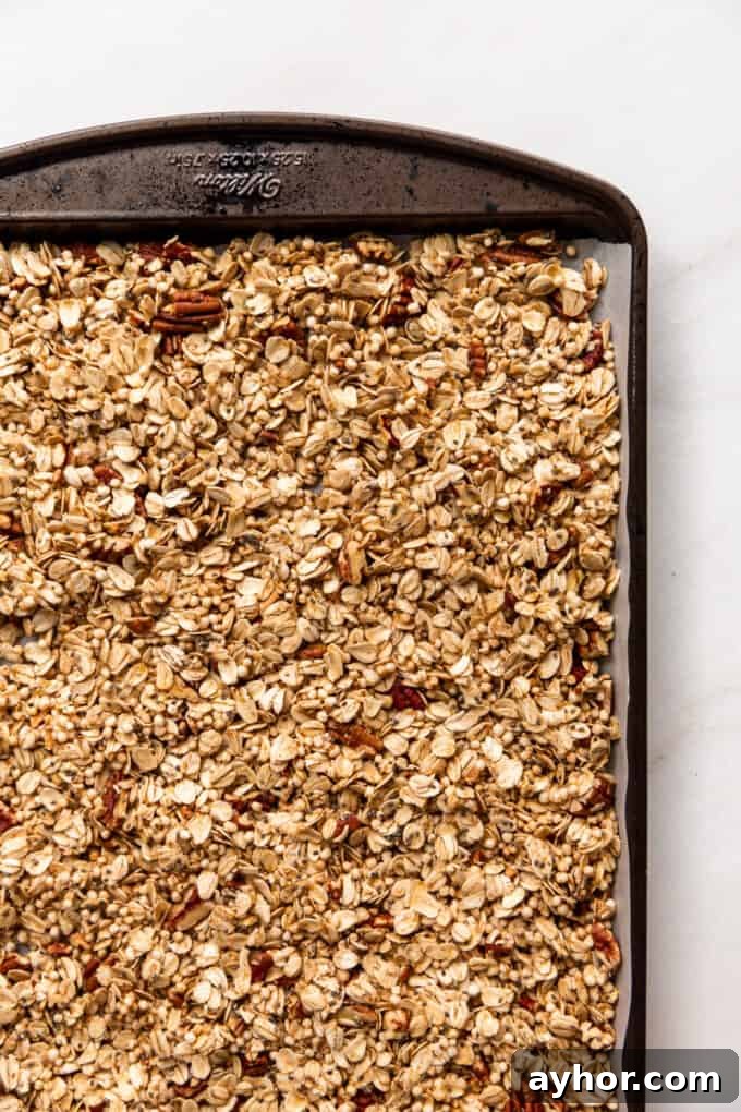 unbaked maple pecan granola on a baking sheet