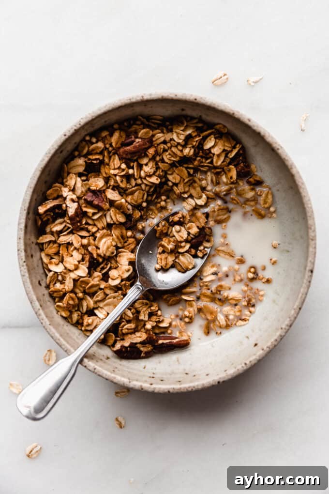 A bowl of maple pecan granola with almond milk