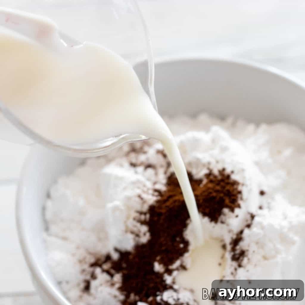 milk being added to powdered sugar