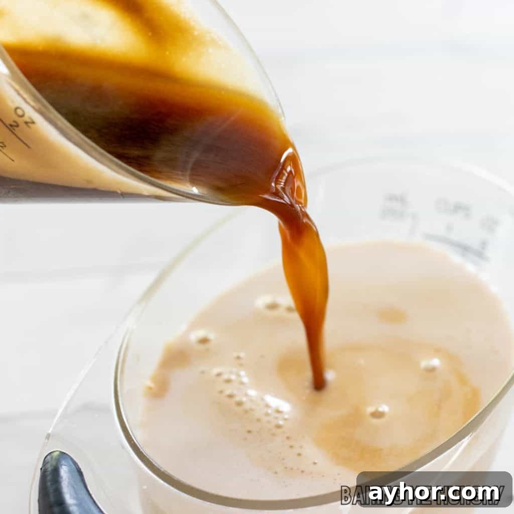 espresso being added to milk