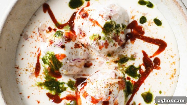 Dahi Bhalla (Dahi Bharay) in a bowl with mint chutney