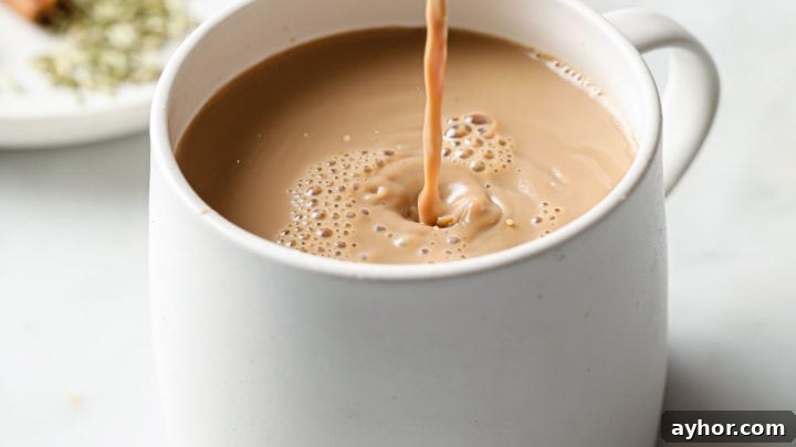 Masala Chai being poured into a cup