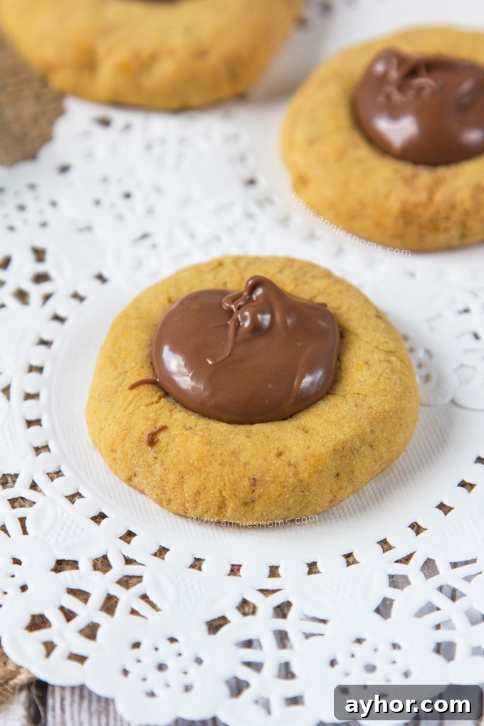 Pumpkin Chocolate Hazelnut Thumbprint Cookies 4 These Pumpkin Nutella Thumbprint Cookies are little bites of heaven.