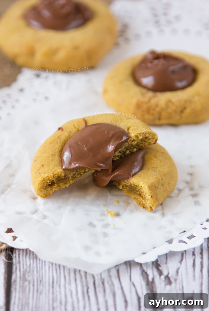 Pumpkin Chocolate Hazelnut Thumbprint Cookies 6 These Pumpkin Nutella Thumbprint Cookies are little bites of heaven.