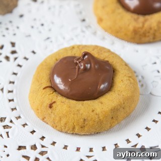 Pumpkin Chocolate Hazelnut Thumbprint Cookies 7 These Pumpkin Nutella Thumbprint Cookies are little bites of heaven.