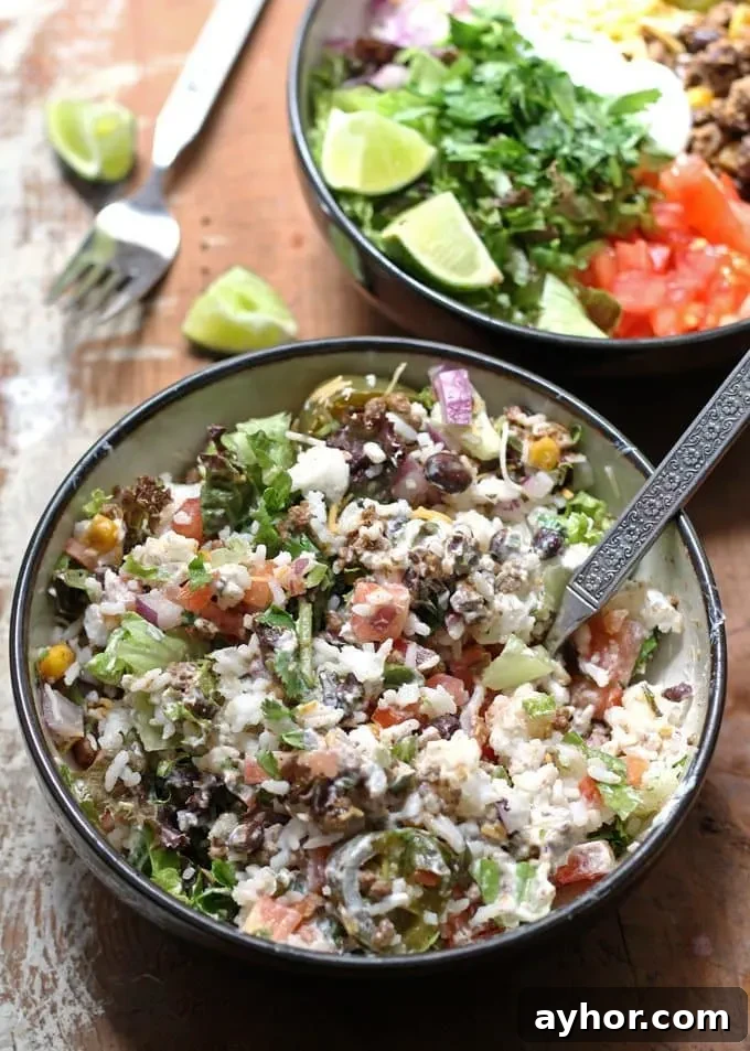 Loaded Burrito Bowls Recipe: Flavorful Chicken & Veggie Bowls 5 Top view of a loaded burrito bowl ready to serve.