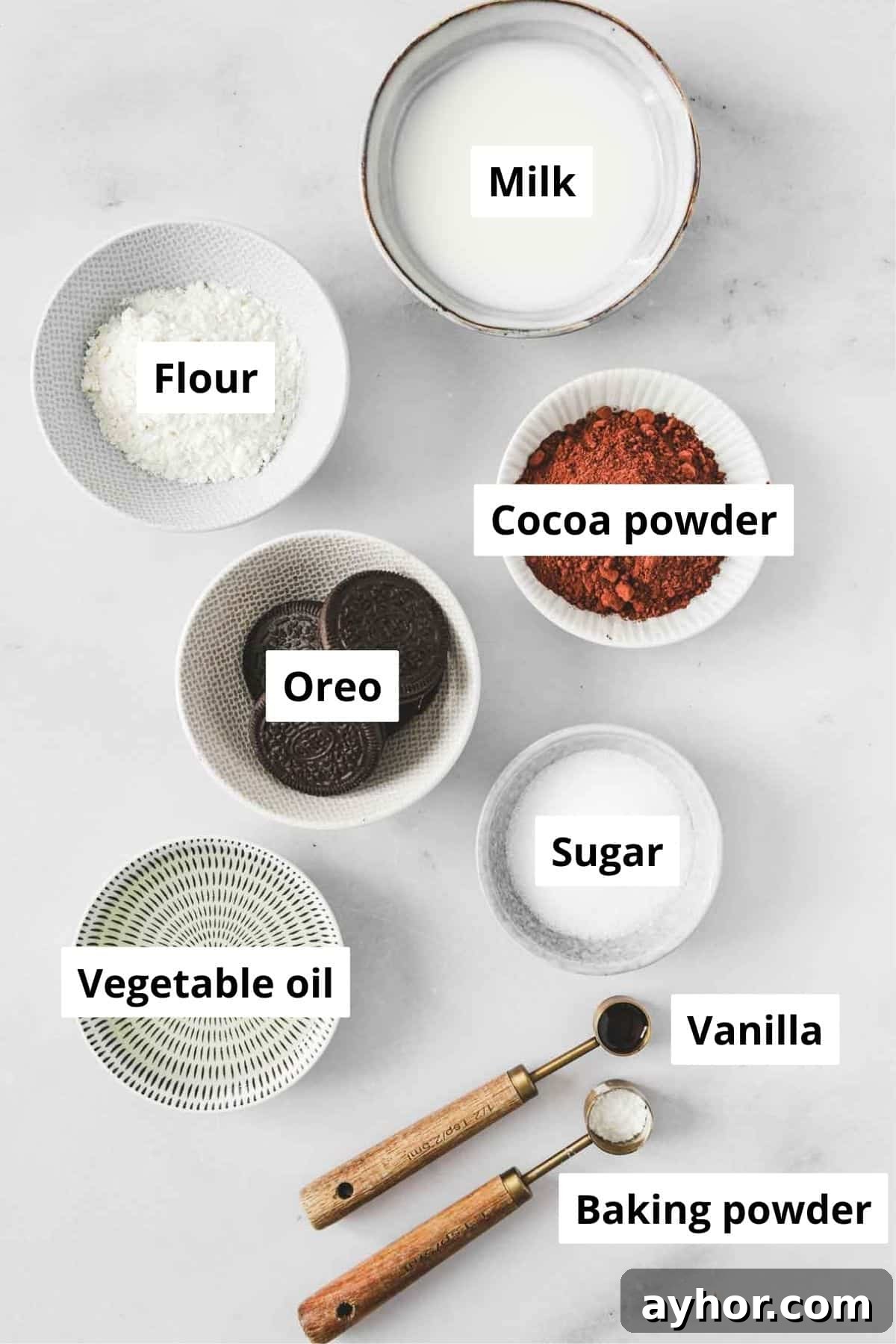 ingredients for oreo microwave mug cake in bowls