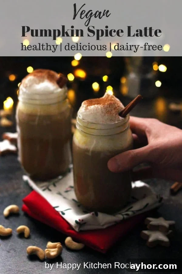 Healthy Vegan Pumpkin Spice Latte - Holding One Mason Jar with Lights in the Background