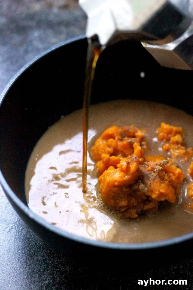 Healthy Vegan Pumpkin Spice Latte Pouring into a Saucepan