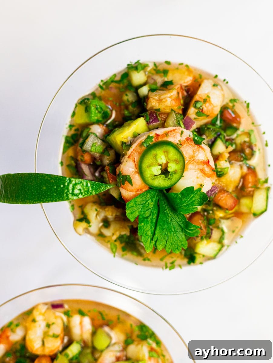 Authentic Mexican Shrimp Cocktail Recipe — Zesty Seafood Ceviche 2 Mexican shrimp cocktail in a glass