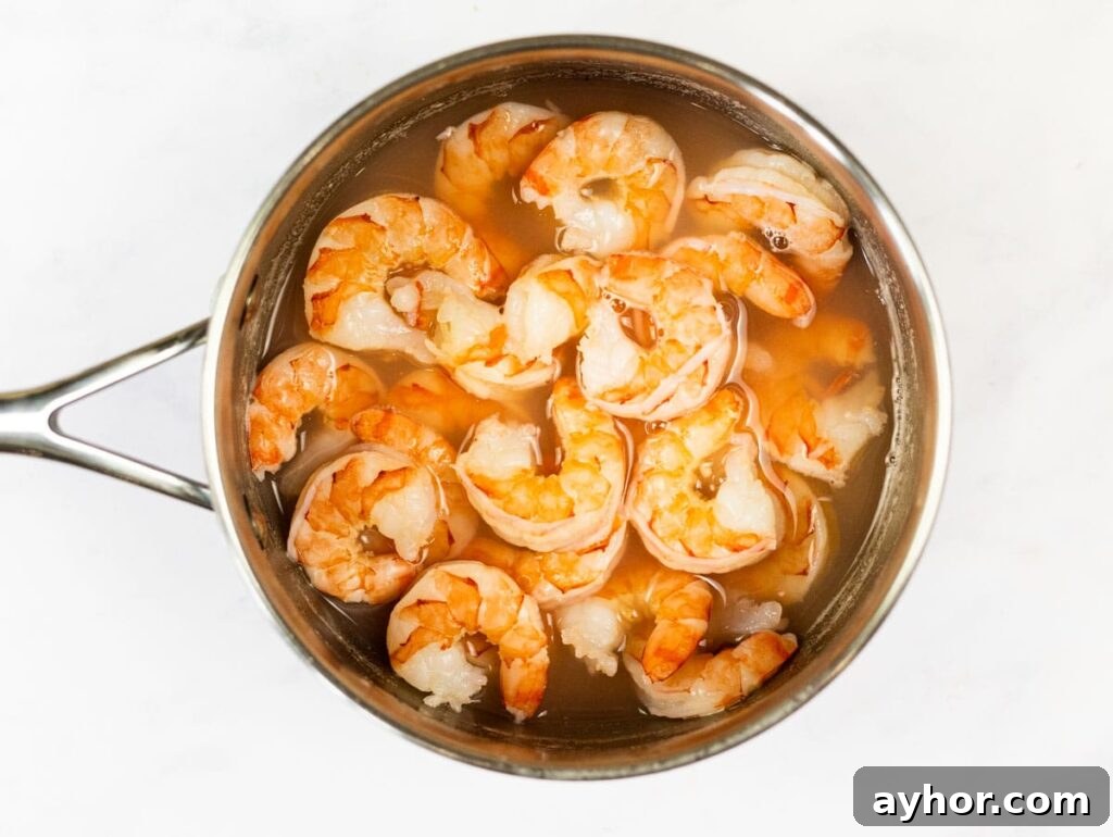 Authentic Mexican Shrimp Cocktail Recipe — Zesty Seafood Ceviche 4 Cooked shrimp cooling