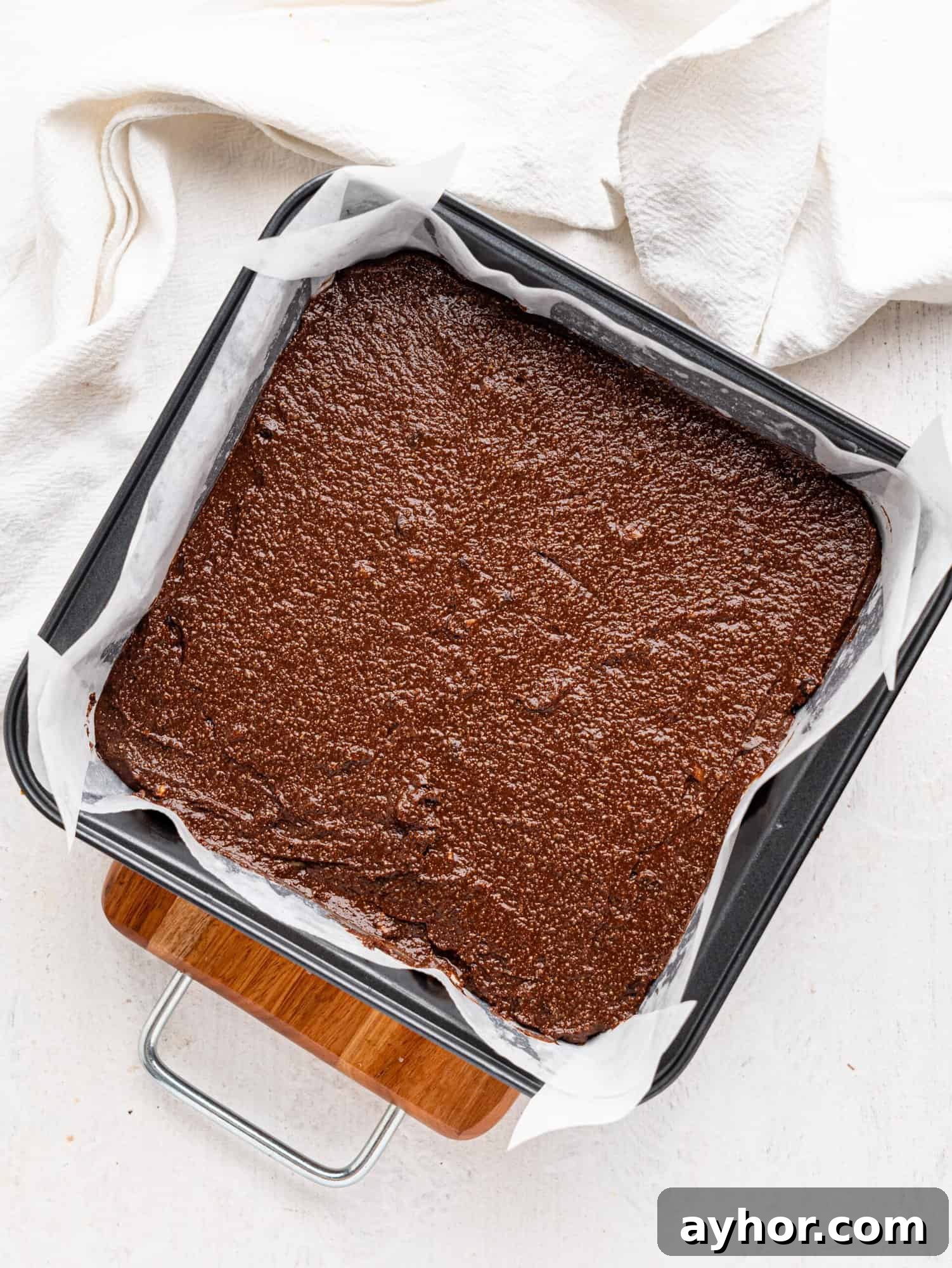 Cottage cheese brownie batter in a baking tin.