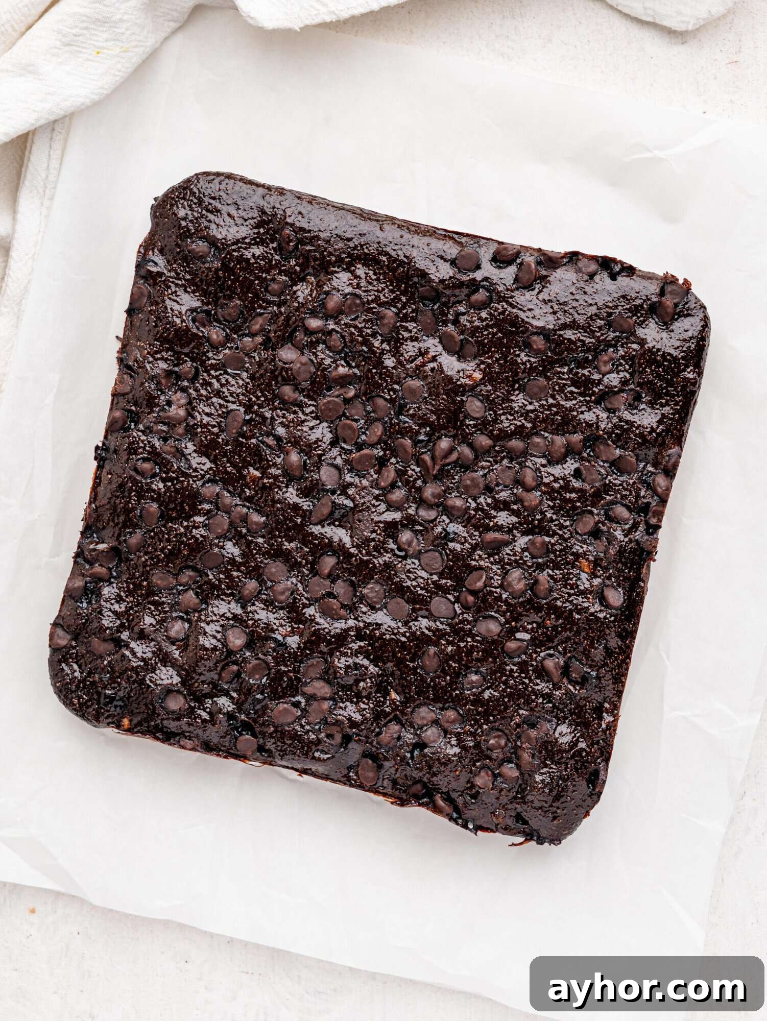 Freshly baked cottage cheese brownies before slicing.