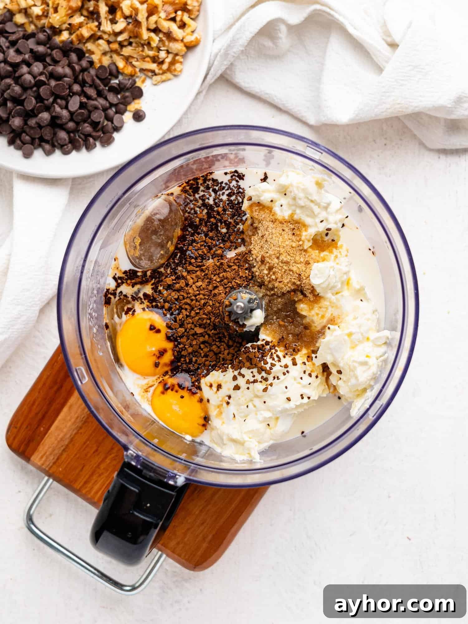 Cottage cheese brownies wet ingredients in a mixing bowl.