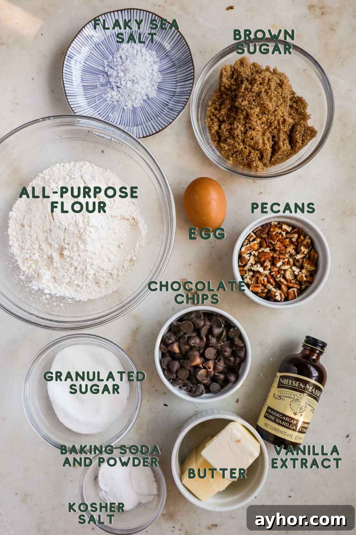 Ingredients pecan chocolate chip cookies, flour, brown sugar, pecans, egg, granulated sugar, chocolate chips, vanilla, baking soda and powder, butter, kosher salt, flaky salt.
