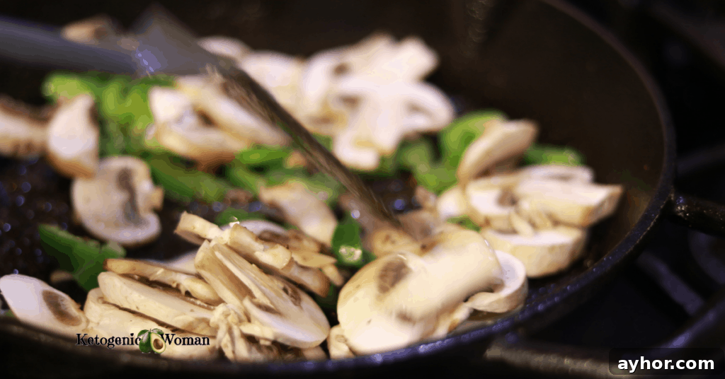 Keto Philly Cheesesteak Skillet: Low-Carb Dinner Recipe 3 peppers and mushrooms in cast iron pan