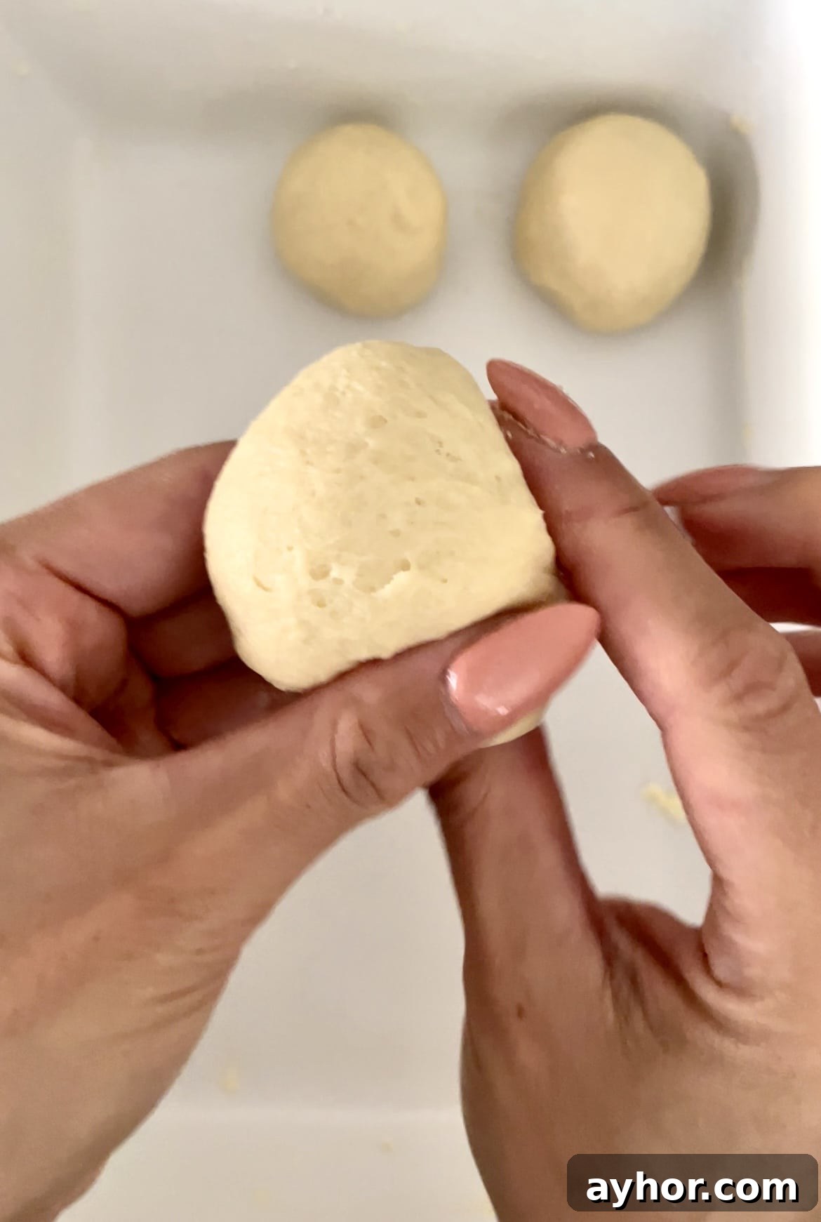 1-Hour Soft and Fluffy Dinner Rolls Recipe 6 forming dough into balls for yeast rolls