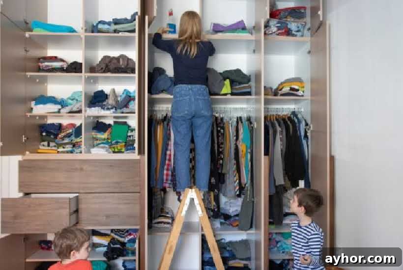 Clear Out These 20 Home Items Before Christmas 3 Woman and two children organizing a closet