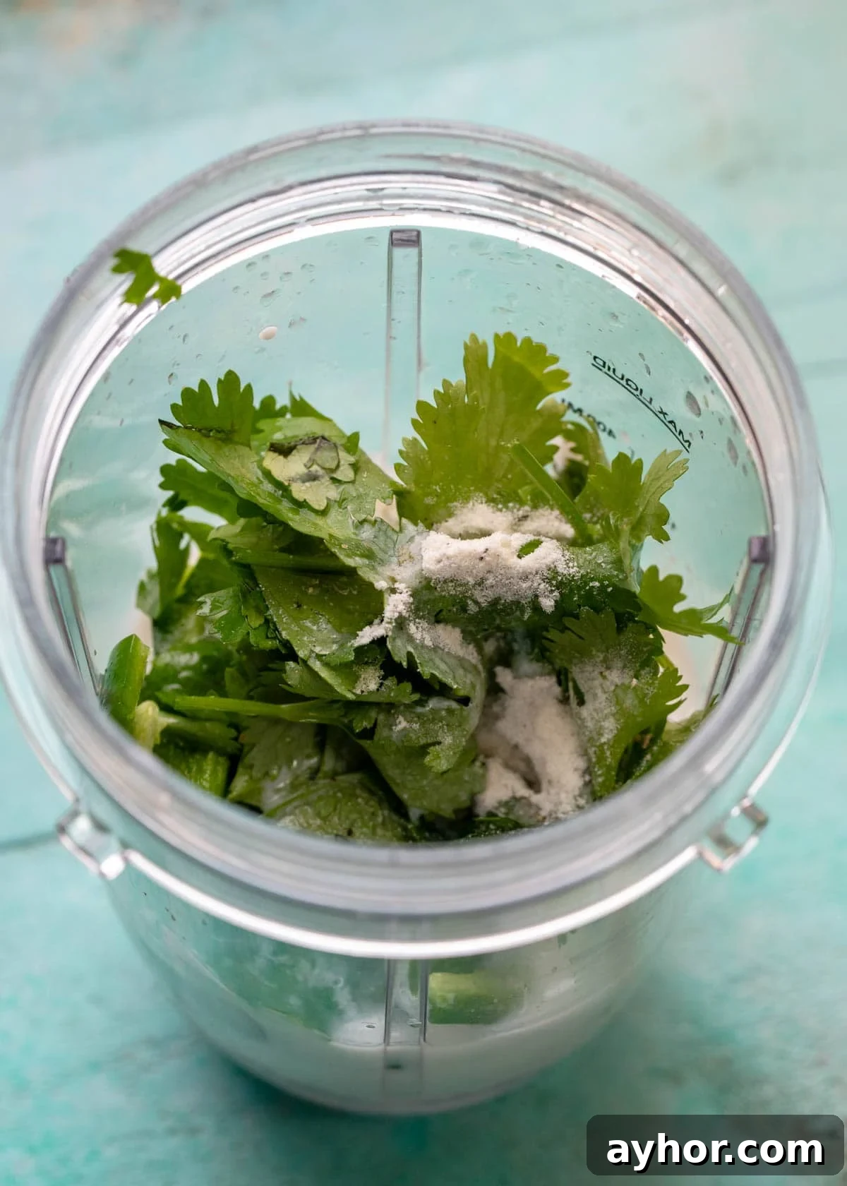 Creamy Jalapeño Ranch Dressing Recipe for Spicy Salads 3 cilantro, milk, yogurt, ranch dressing mix, lime juice, and jalapenos in a blender cup