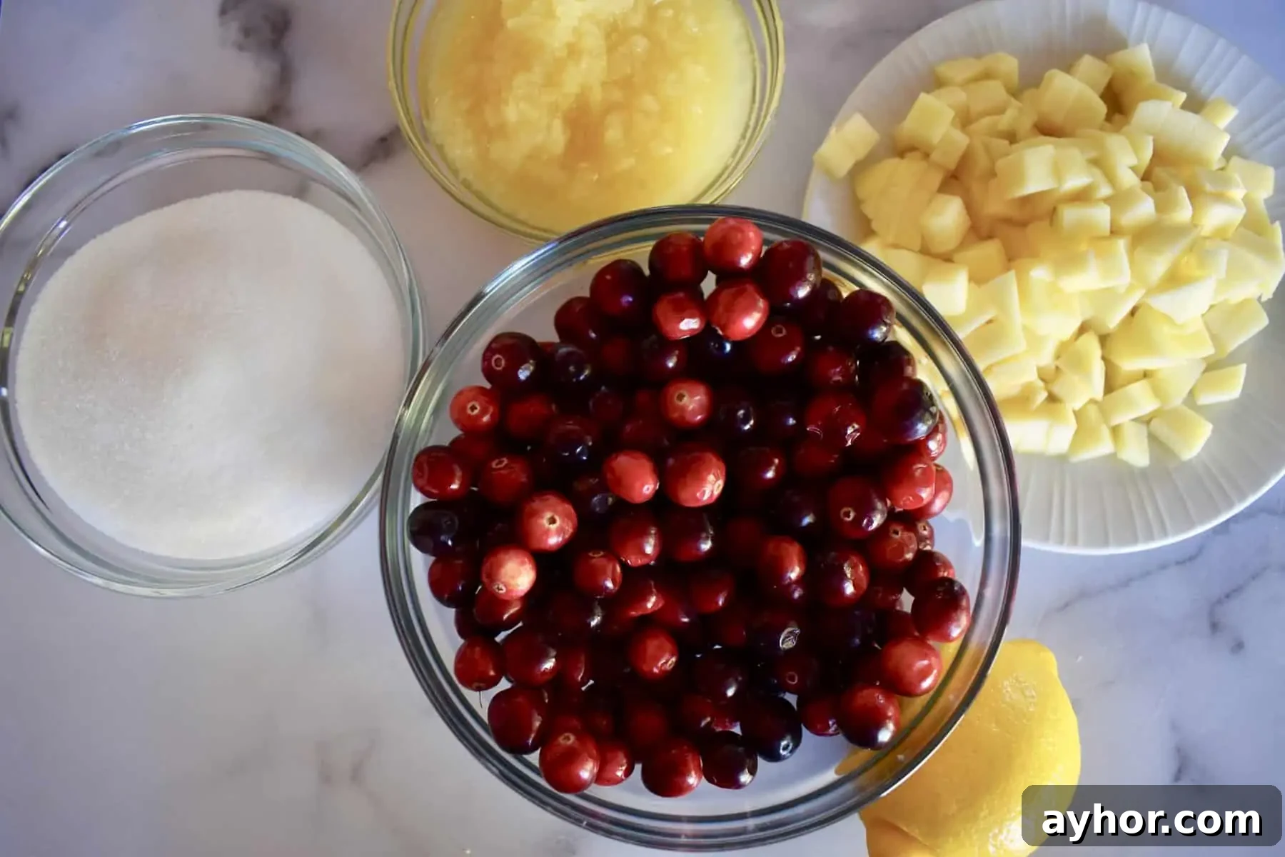 Cranberry Pineapple Sauce Recipe for Holiday Side Dish 3 cranberries, sugar, pineapple, lemon, and apple for making cranberry pineapple sauce.