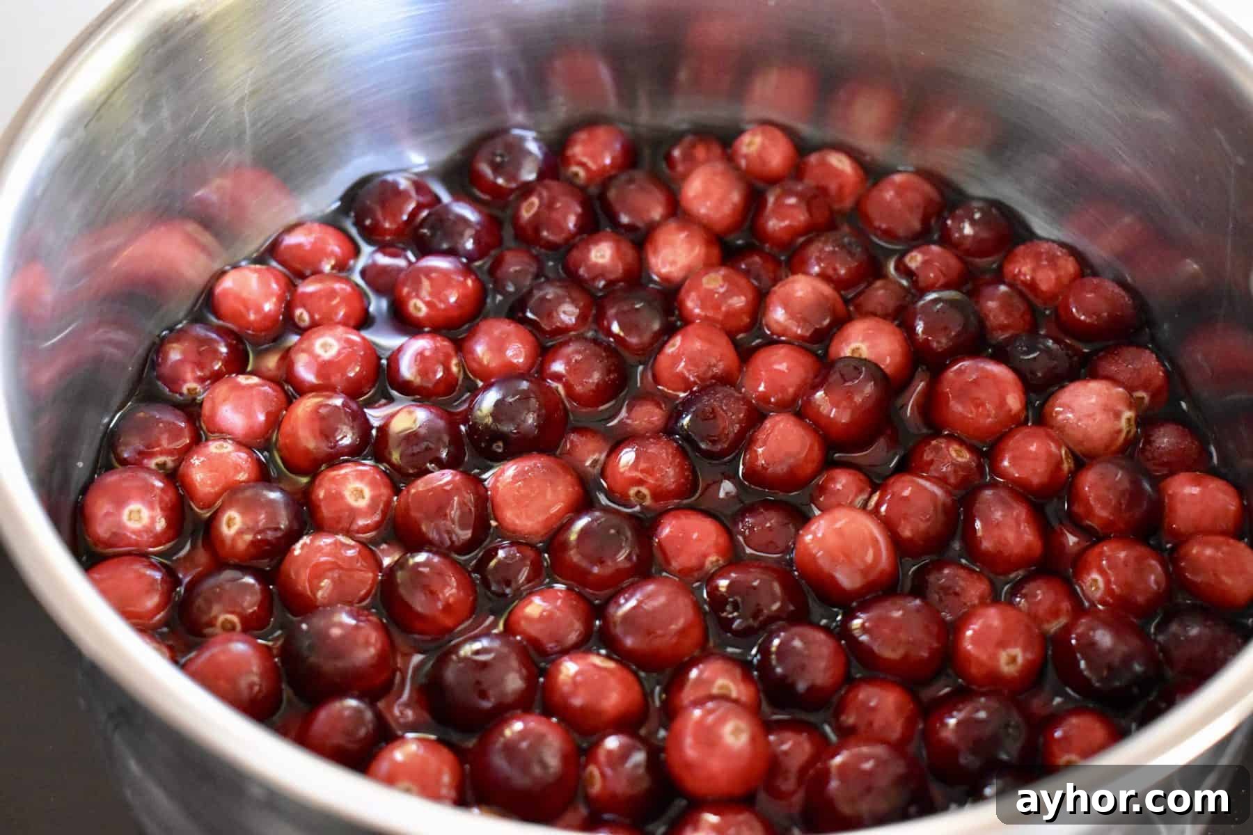 Cranberry Pineapple Sauce Recipe for Holiday Side Dish 4 cranberries, sugar, and water in pot