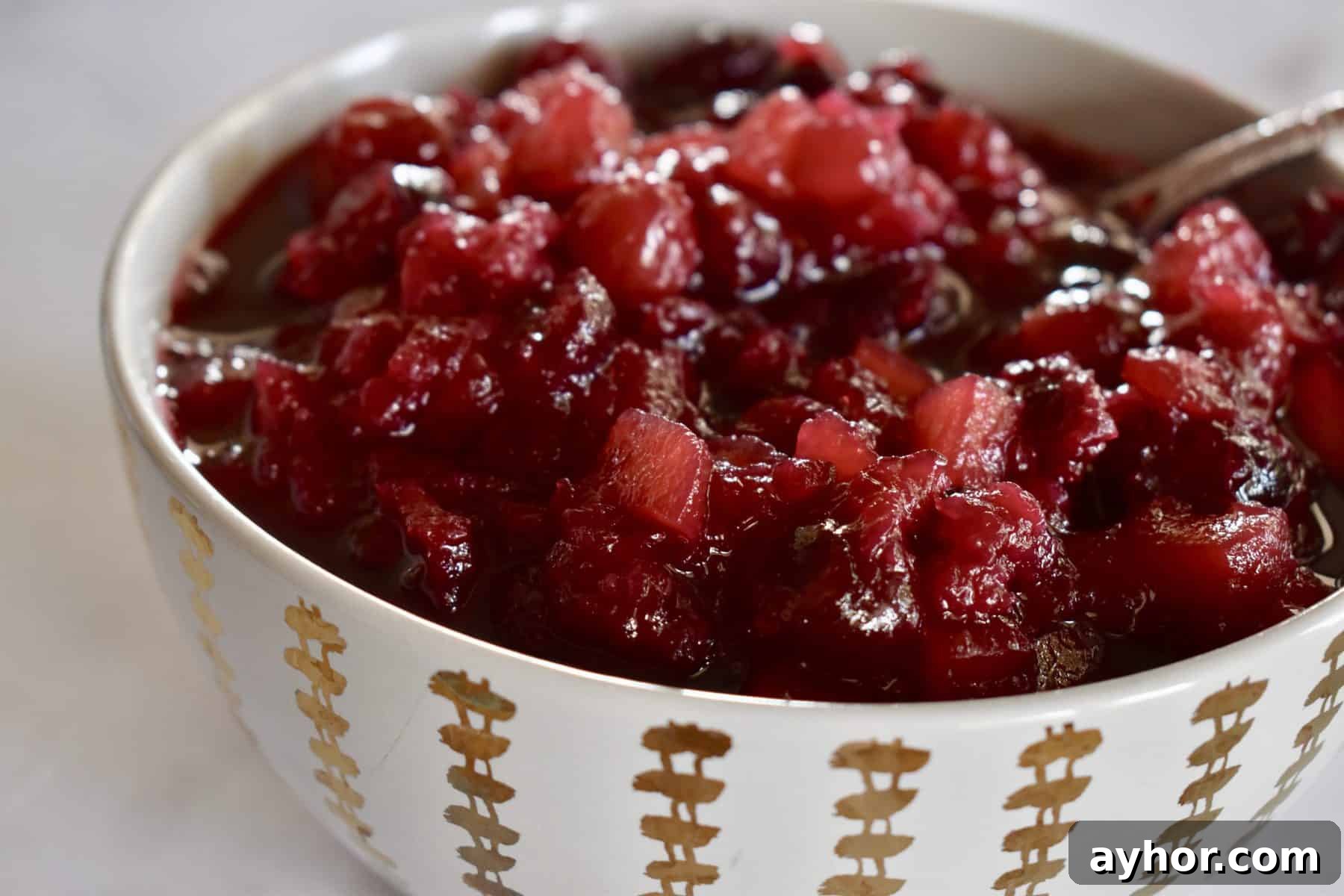 Cranberry Pineapple Sauce Recipe for Holiday Side Dish 8 Cranberry Pineapple Sauce in a white bowl.