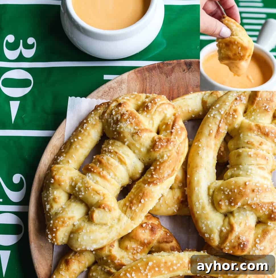 Soft pretzels shaped like footballs with beer cheese dip