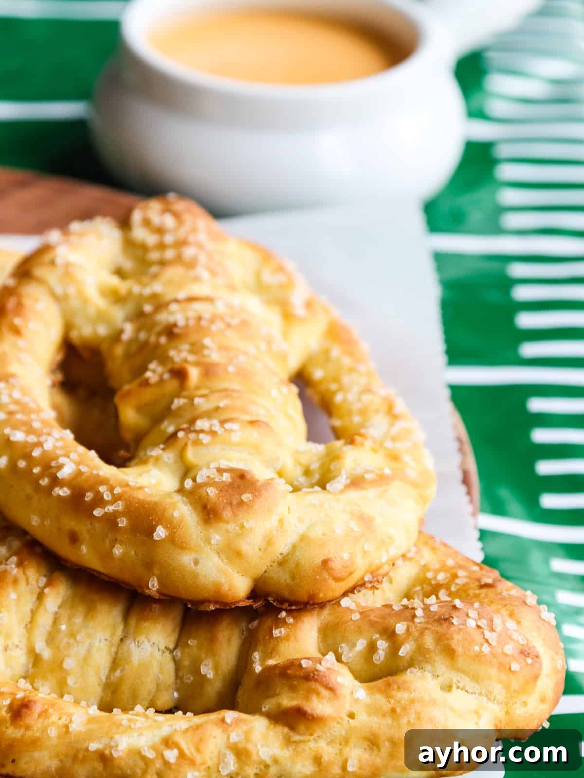 Football pretzels stacked with beer cheese dip