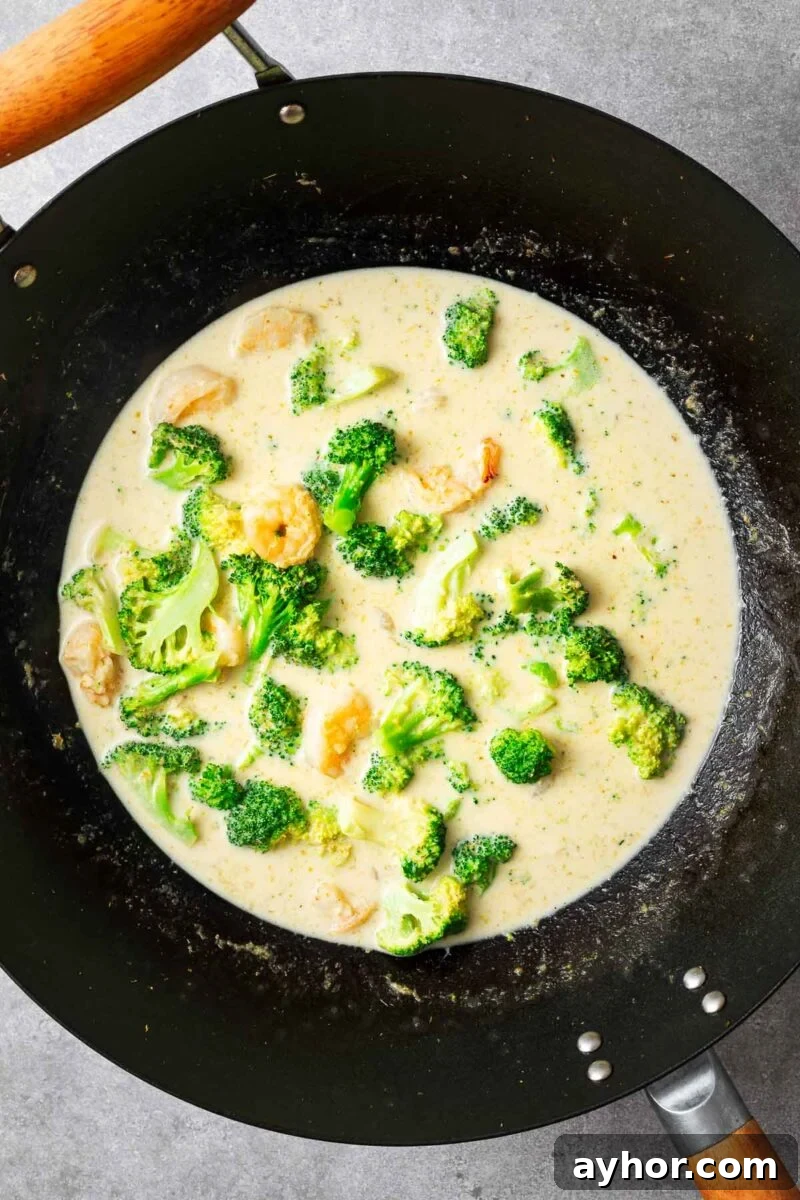 Thai green curry in a wok.