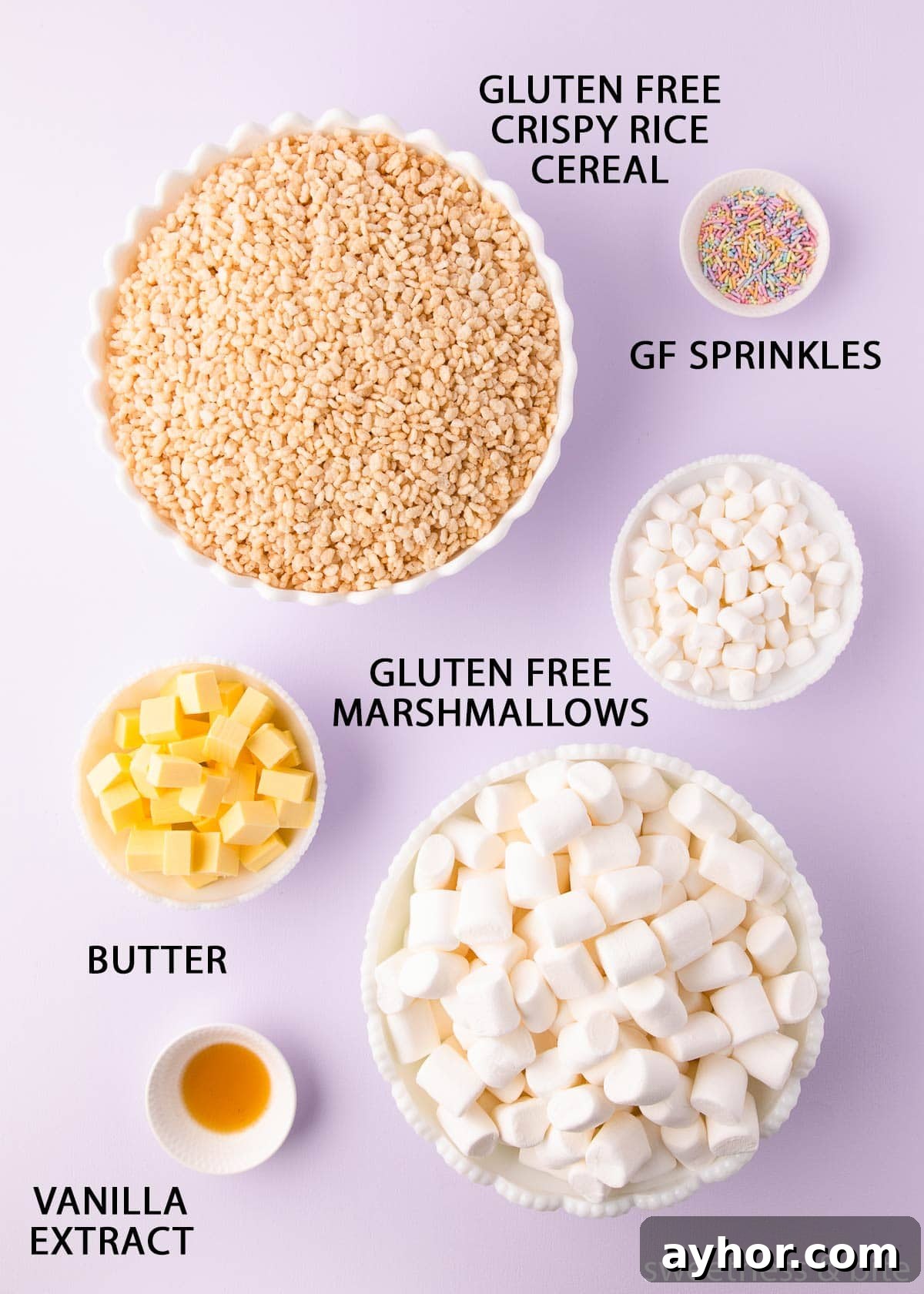 Gluten-Free Rice Krispie Treats Recipe That Really Crisps 3 The ingredients in white bowls on a light purple background with labels in black uppercase text.
