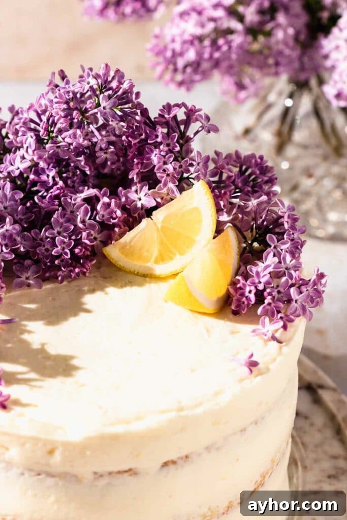 Lemon-Lilac Cake Recipe: Light Floral Citrus Dessert 6 Lilac cake with lemon wedges and fresh lilac flowers on top