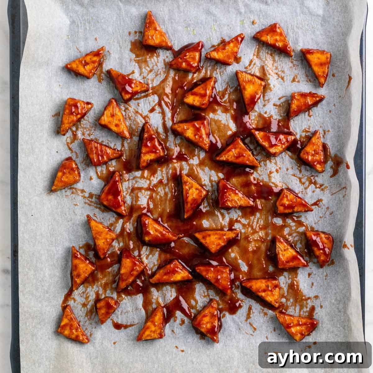 Grilled BBQ Tofu Recipe: Smoky, Glazed Plant-Based Dish 10 Baked tofu triangles coated with BBQ sauce before baking