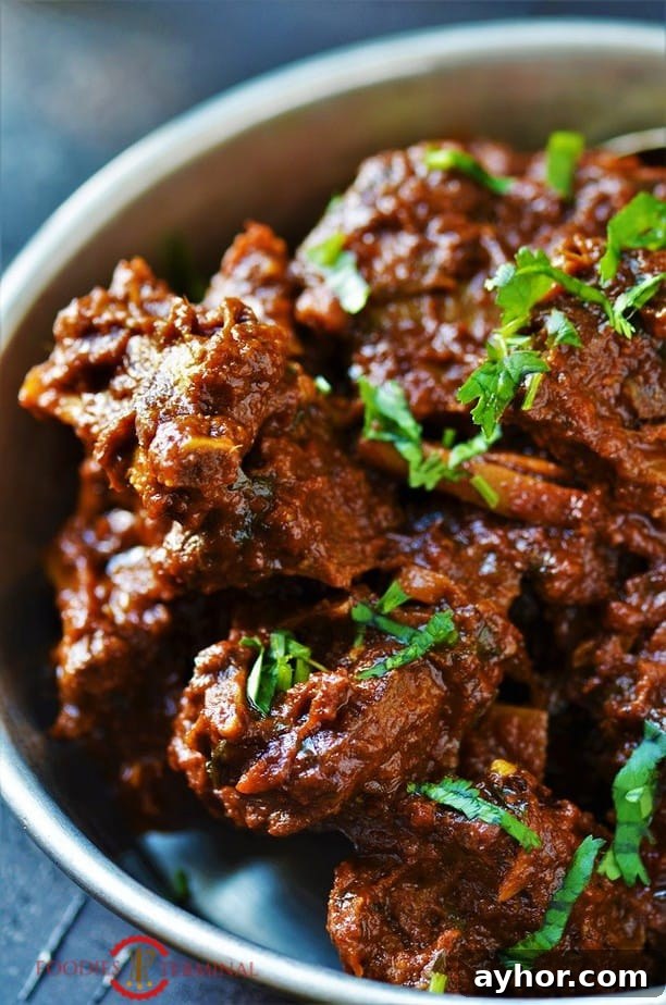 Pakistani Mutton bhuna garnished with cilantro