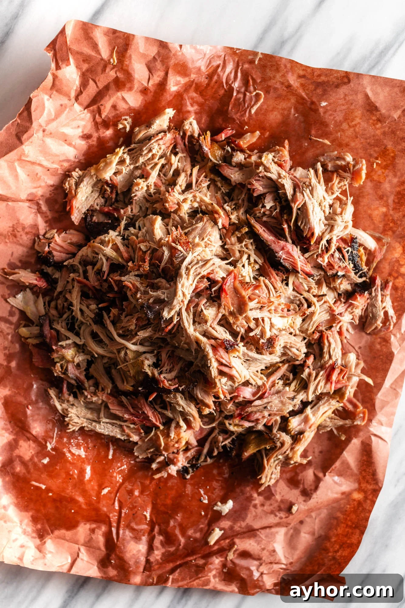 Smoking Pork Shoulder at 225°F: Time Guide for Tender Results 2 Smoked pulled pork on butcher paper.