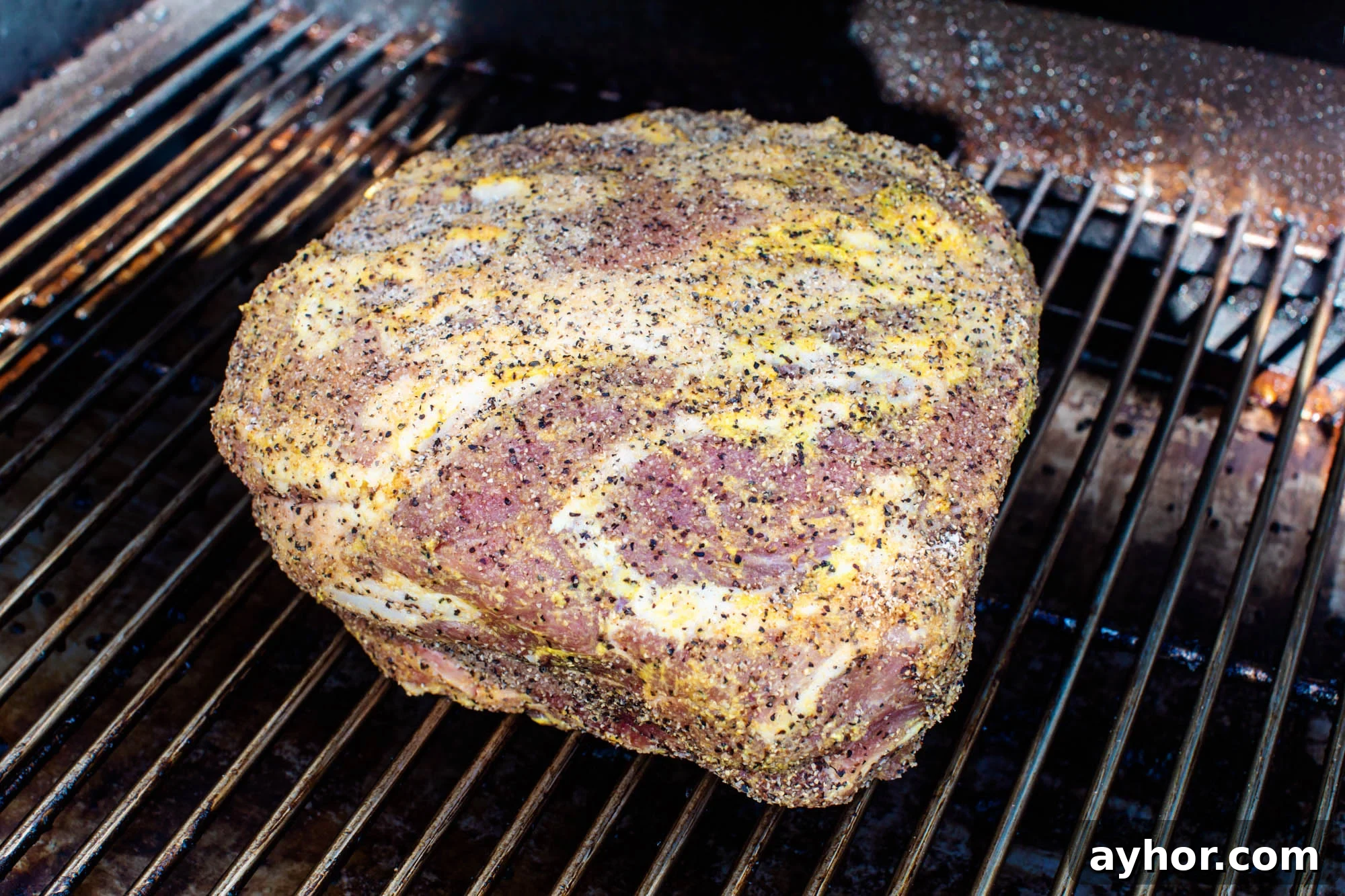 Smoking Pork Shoulder at 225°F: Time Guide for Tender Results 3 A boston butt on a smoker grill.