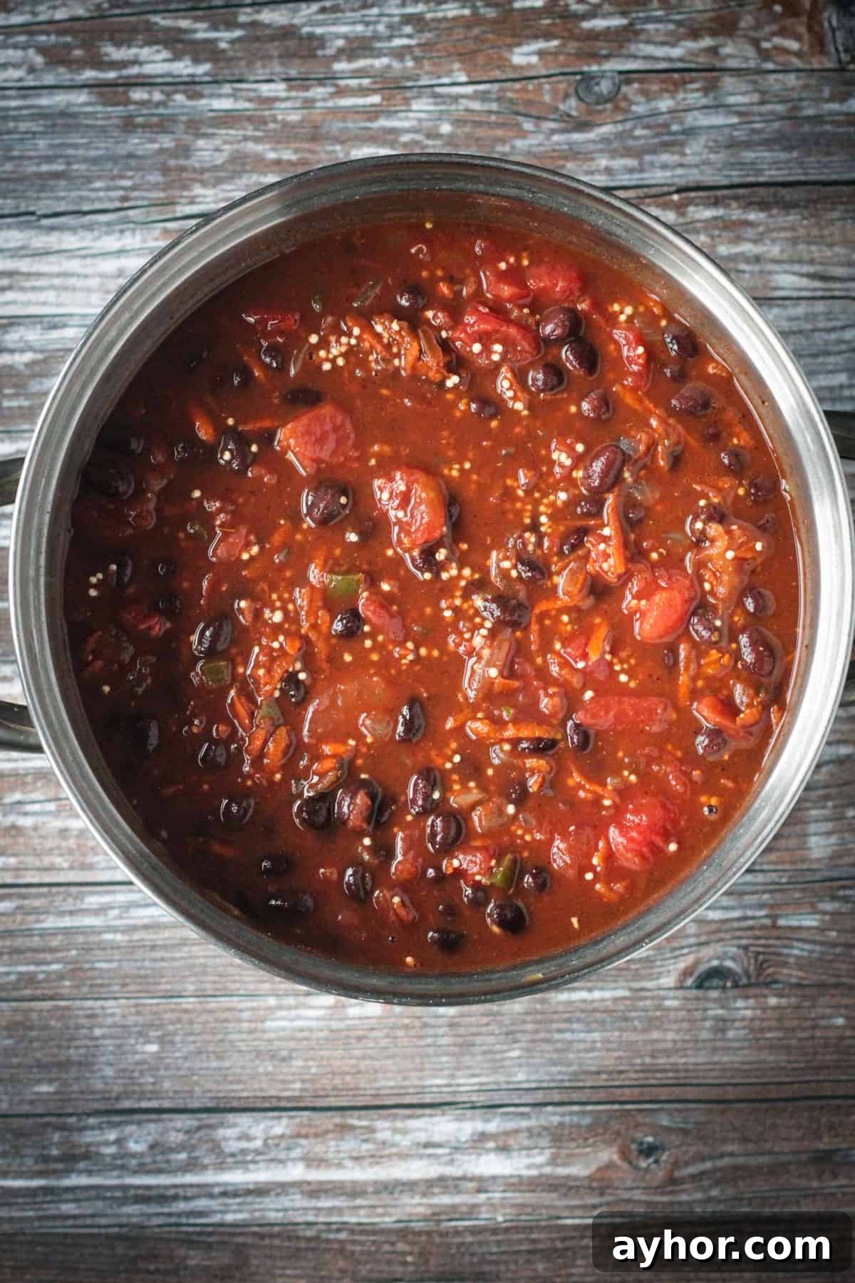 Broth and tomatoes mixed with the beans and veggies.