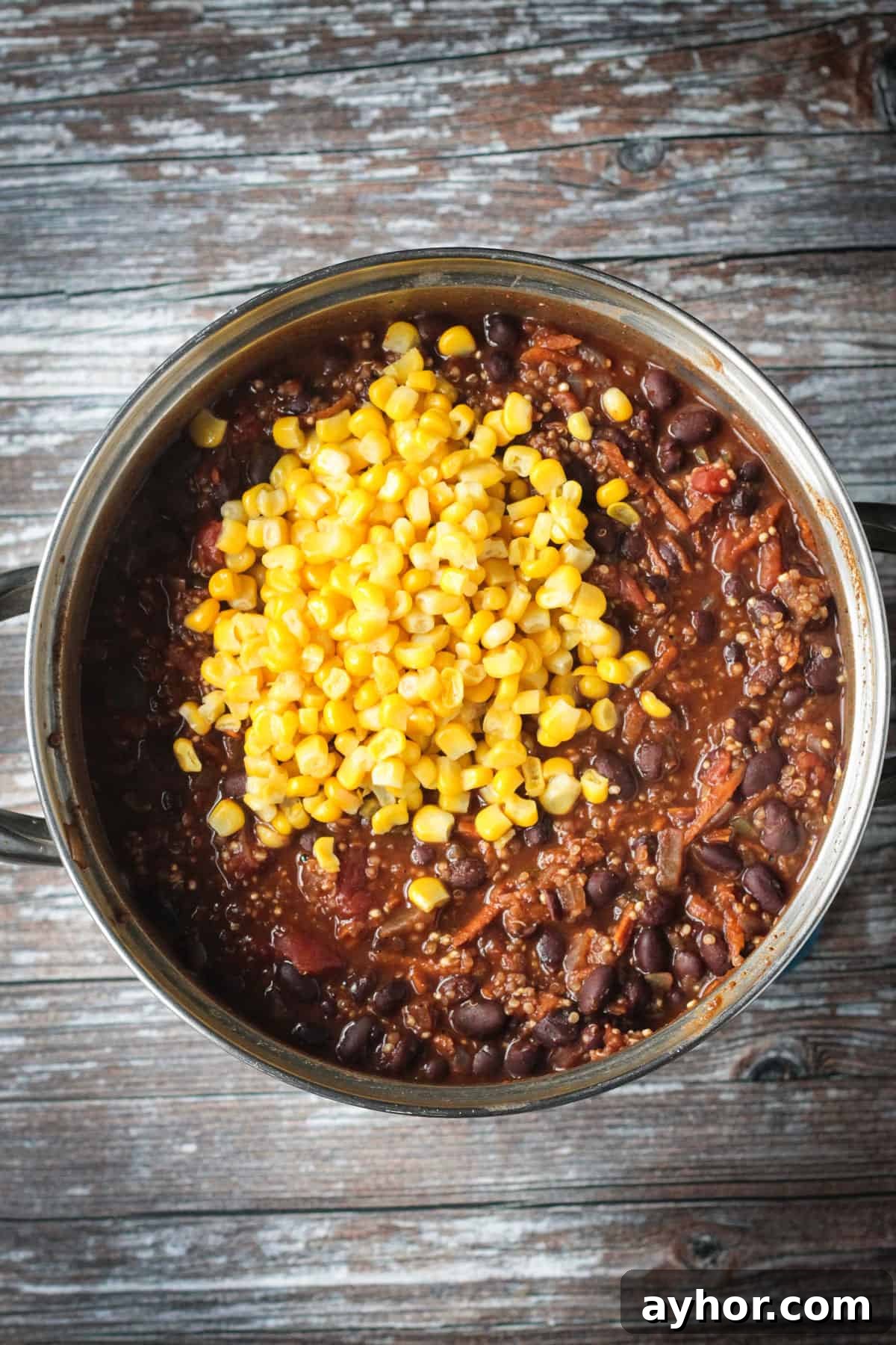 Corn kernels added to the chili.