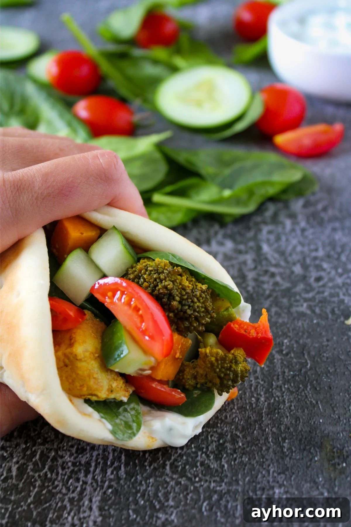 Homemade Chicken Shawarma Vegetable Wrap Recipe 2 chicken shawarma wrap on a counter.