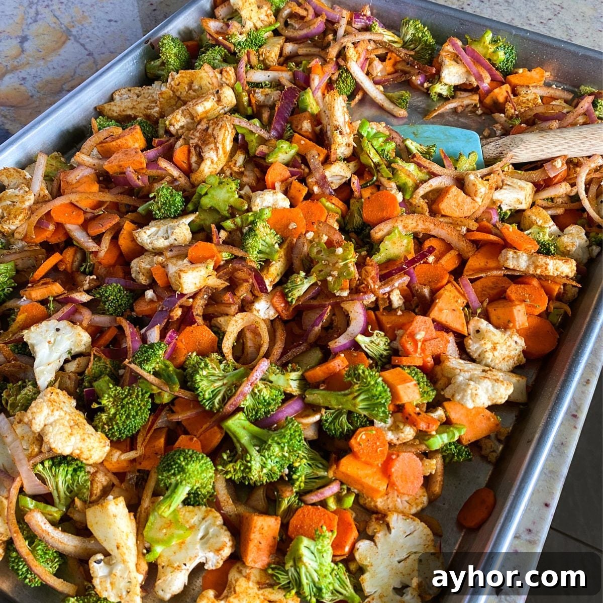 Homemade Chicken Shawarma Vegetable Wrap Recipe 5 roasted seasoned vegetables on a sheet pan.