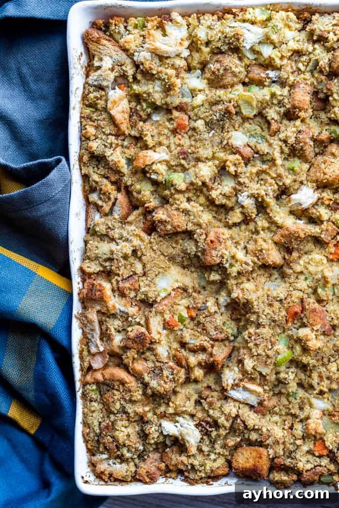 Overhead shot of dressing in white baking dish with blue towel on the side.