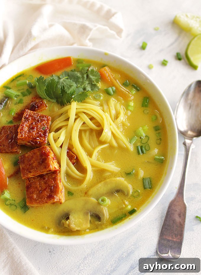 Crispy Tofu Thai Curry Soup Recipe: Flavorful Coconut Broth 5 Thai curry soup, sauteed mushrooms, bell peppers, onions, and rice noddles in a creamy curry broth. And topped with crispy tofu. Only takes 30 minutes to make, the perfect weeknight dinner recipe, especially in the winter! (Vegan, Gluten Free, Vegetarian) | robustrecipes.com